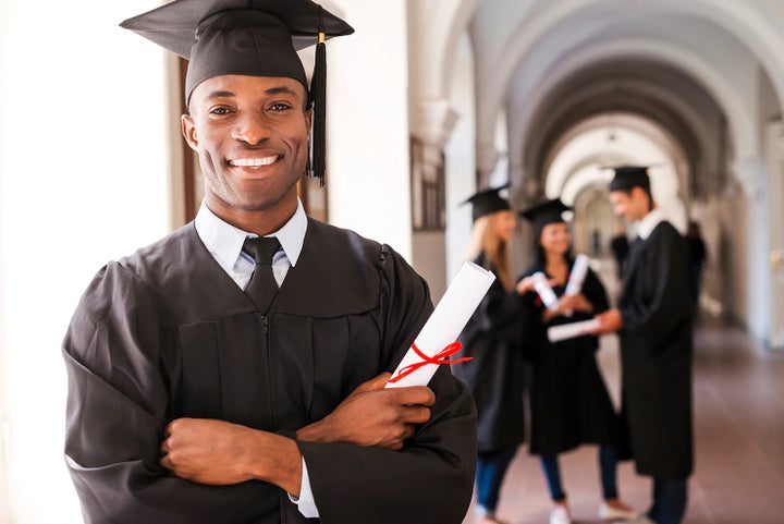 college graduate holding his diploma | Hudson Subaru in Jersey City NJ