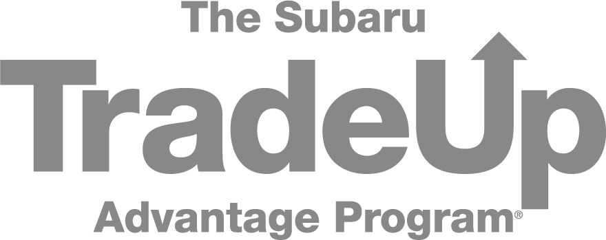 The Subaru TradeUp Advantage Program logo in gray text with an arrow pointing up on 